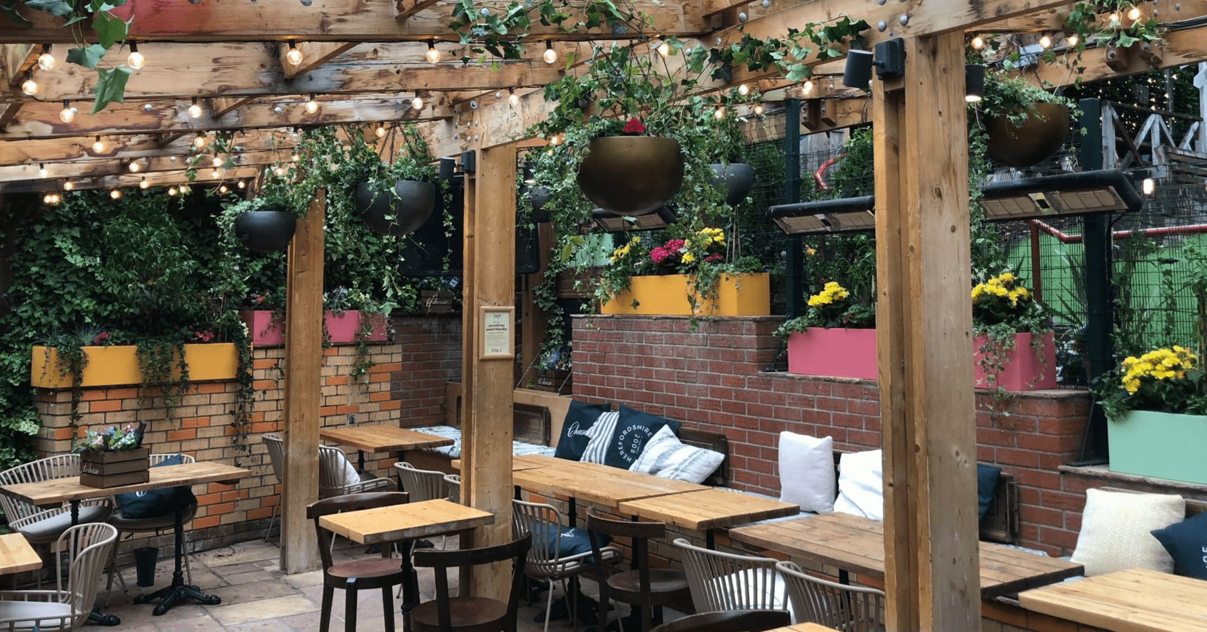 brel-glasgow-hospitality-venue-artificial-ceiling-hanging-planters-colour-troughs-flowers-display