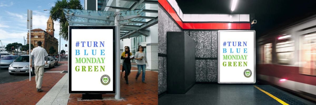 Turn Blue Monday Green signs on a bus stop and a tube station