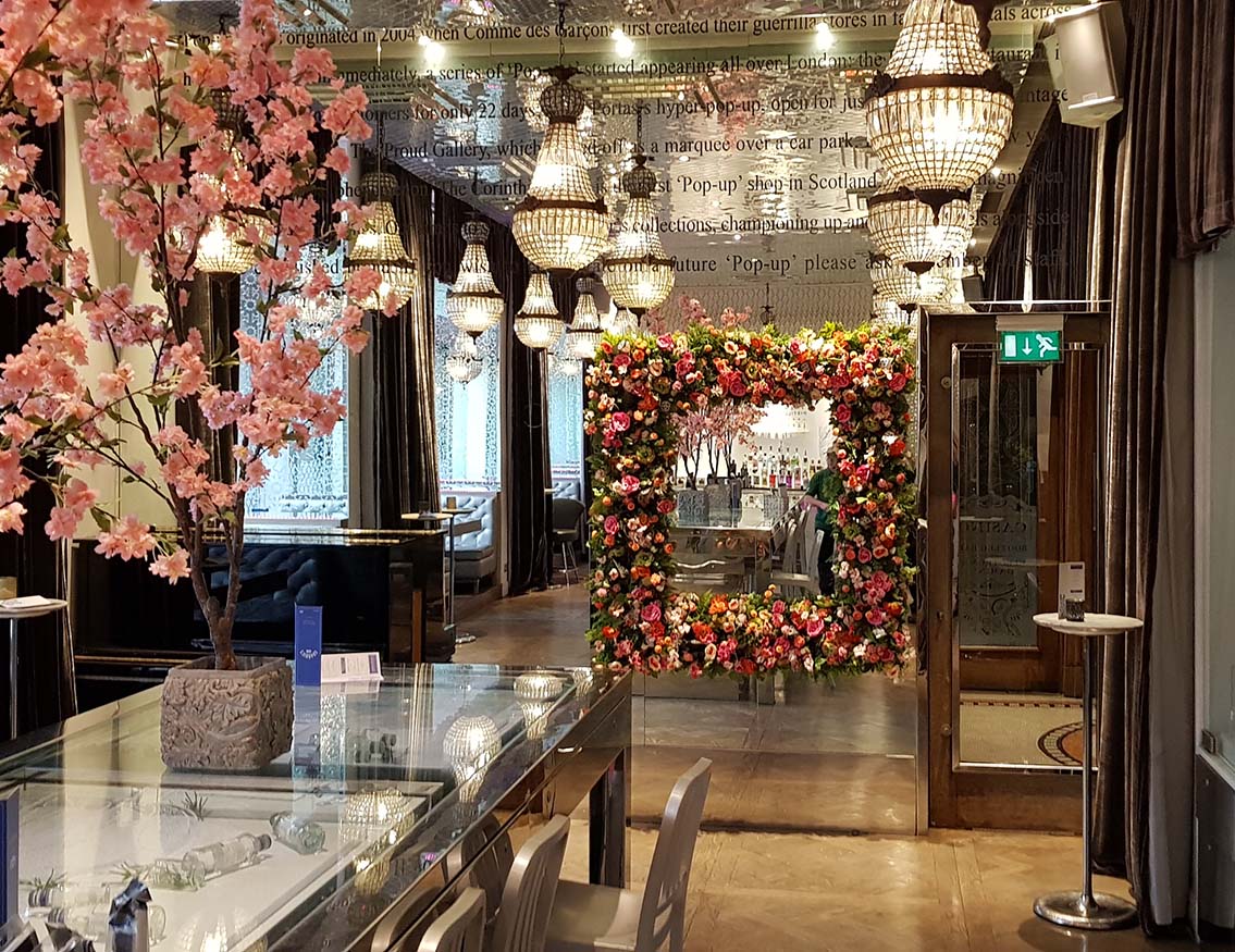 Hospitality: Champagne bar in Glasgow’s luxury Corinthian Club with bespoke oversized floral frame hung on a mirrored feature wall