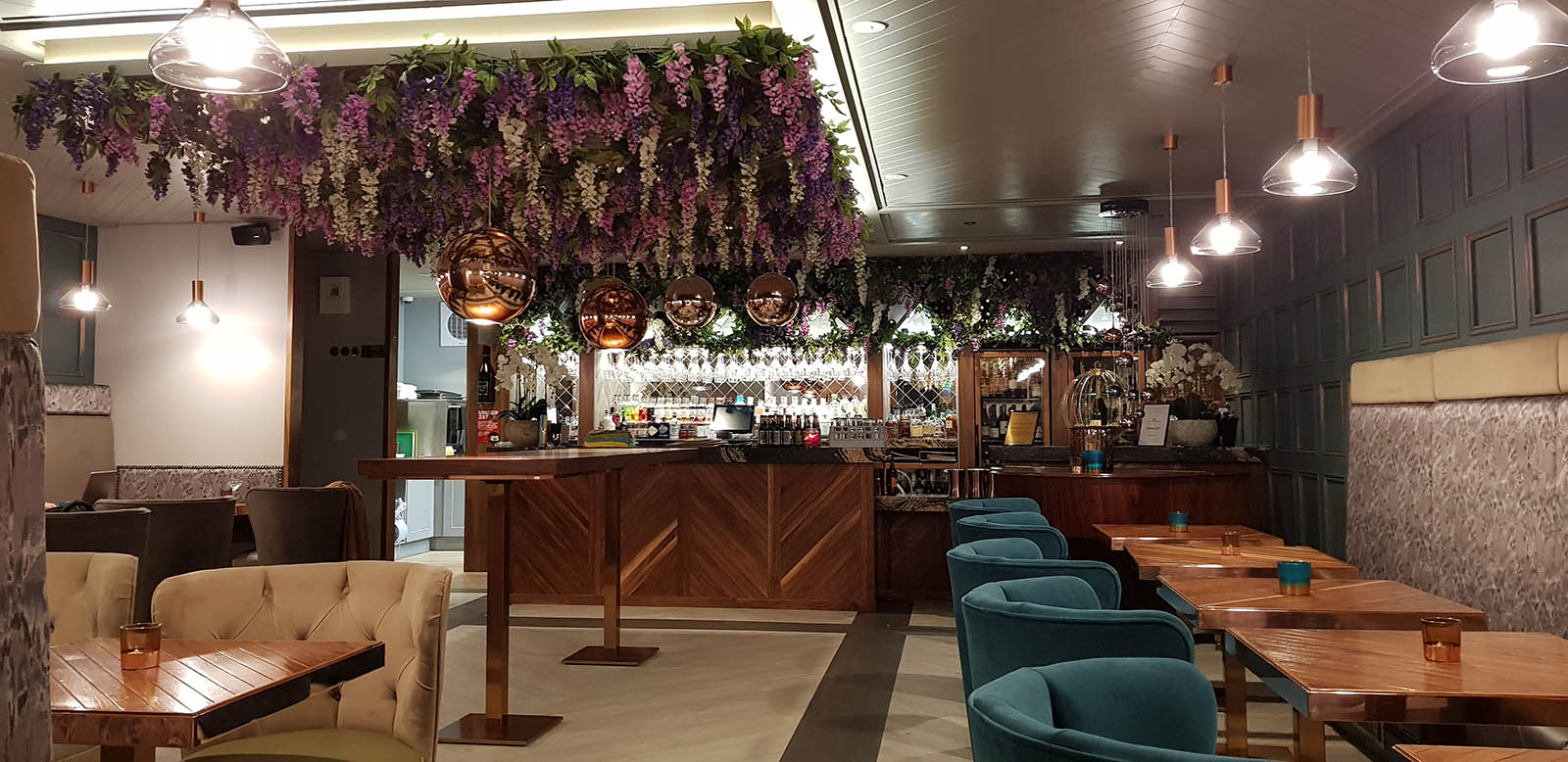 Grape and Grain Aberdeen’s floral ceiling with trailing pink and purple wisteria hanging above the bar and seating area