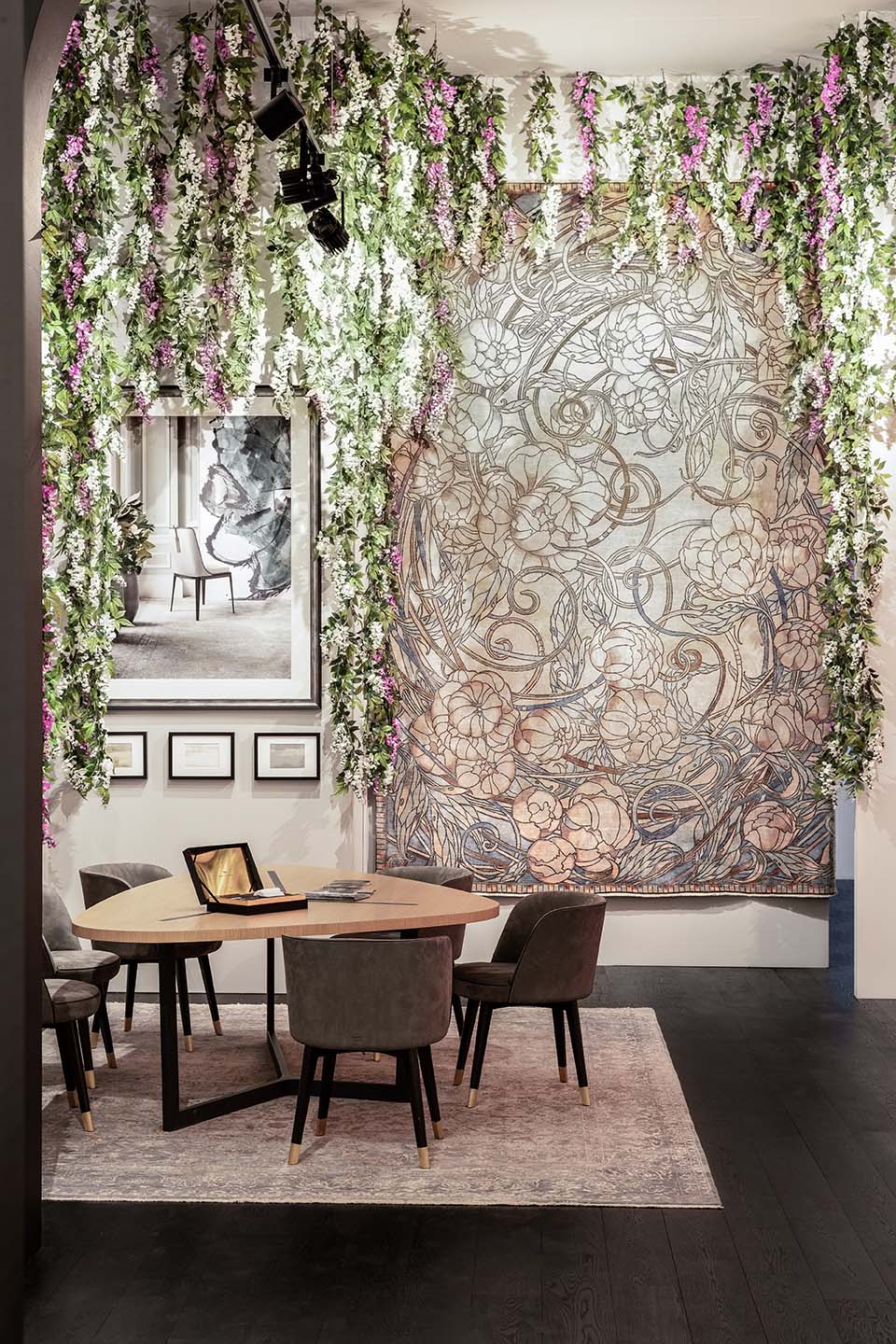 Top London designer’s Milan showcase decorated with trailing artificial wisteria flowers, foliage and lush greenery