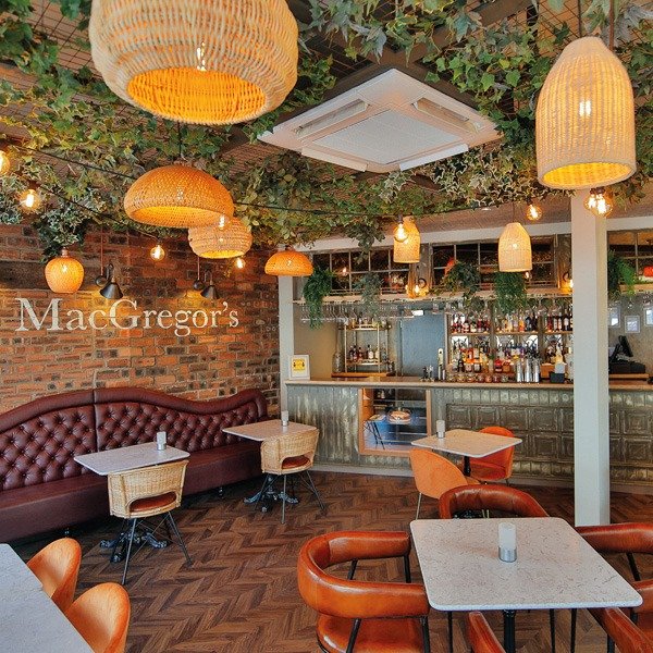 Mr MacGregors restaurant Glasgow featuring a green planted ceiling of artificial trailing foliage to complement its décor or modern, earthy tones