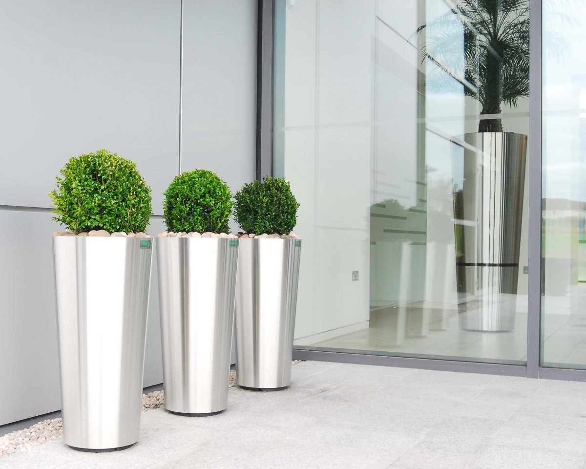 Corporate office with three exterior planters in row – Live Buxus ball topiary plants in tall stainless steel containers