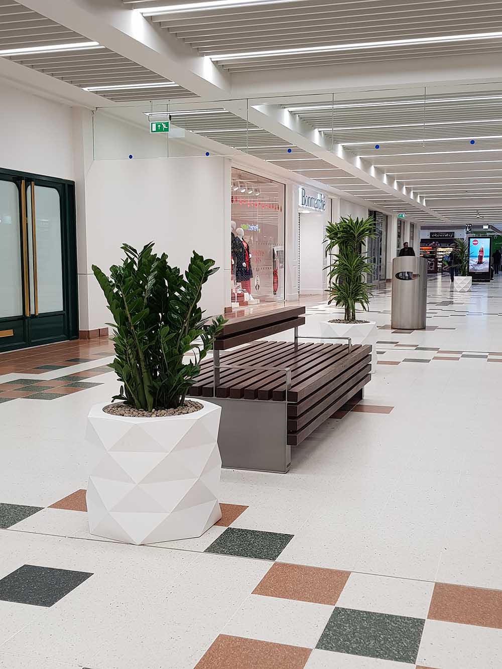 Zamioculcas zamiifolia, Draceana LemonLime and Kentia Palm in designer geometric planters bring shopping centre to life