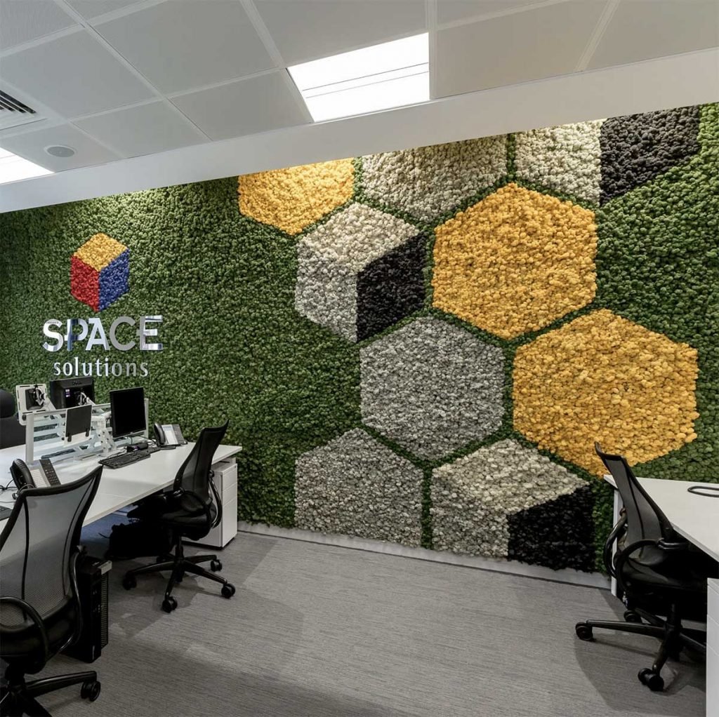 Space solutions 3d effect Nordik Moss walls with shaded moss hexagons and bespoke signage to create an office feature wall
