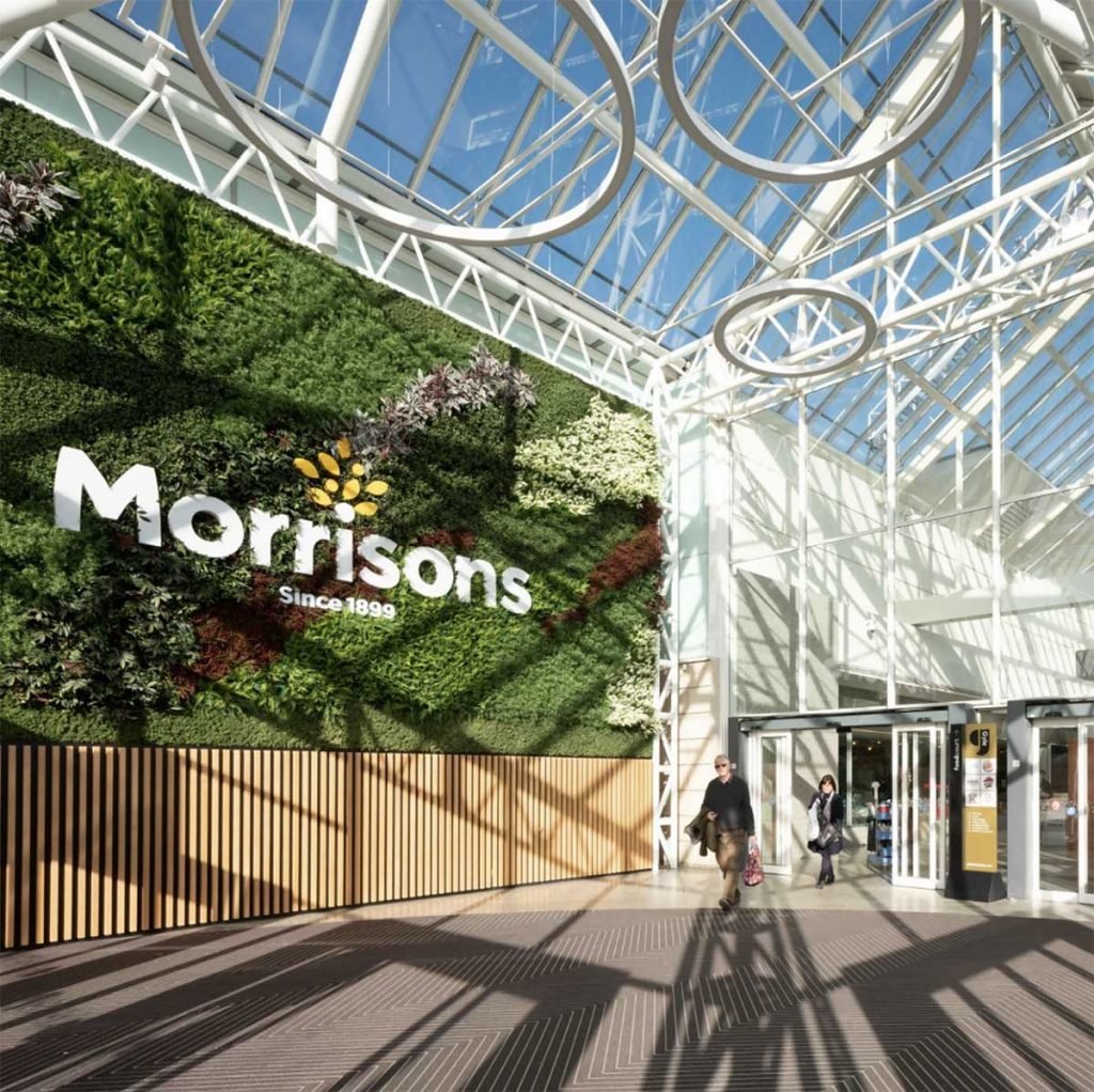 Bespoke Morrisons 50 square metre living wall at the Gyle shopping centre Edinburgh filled with artificial plants and Nordik Moss