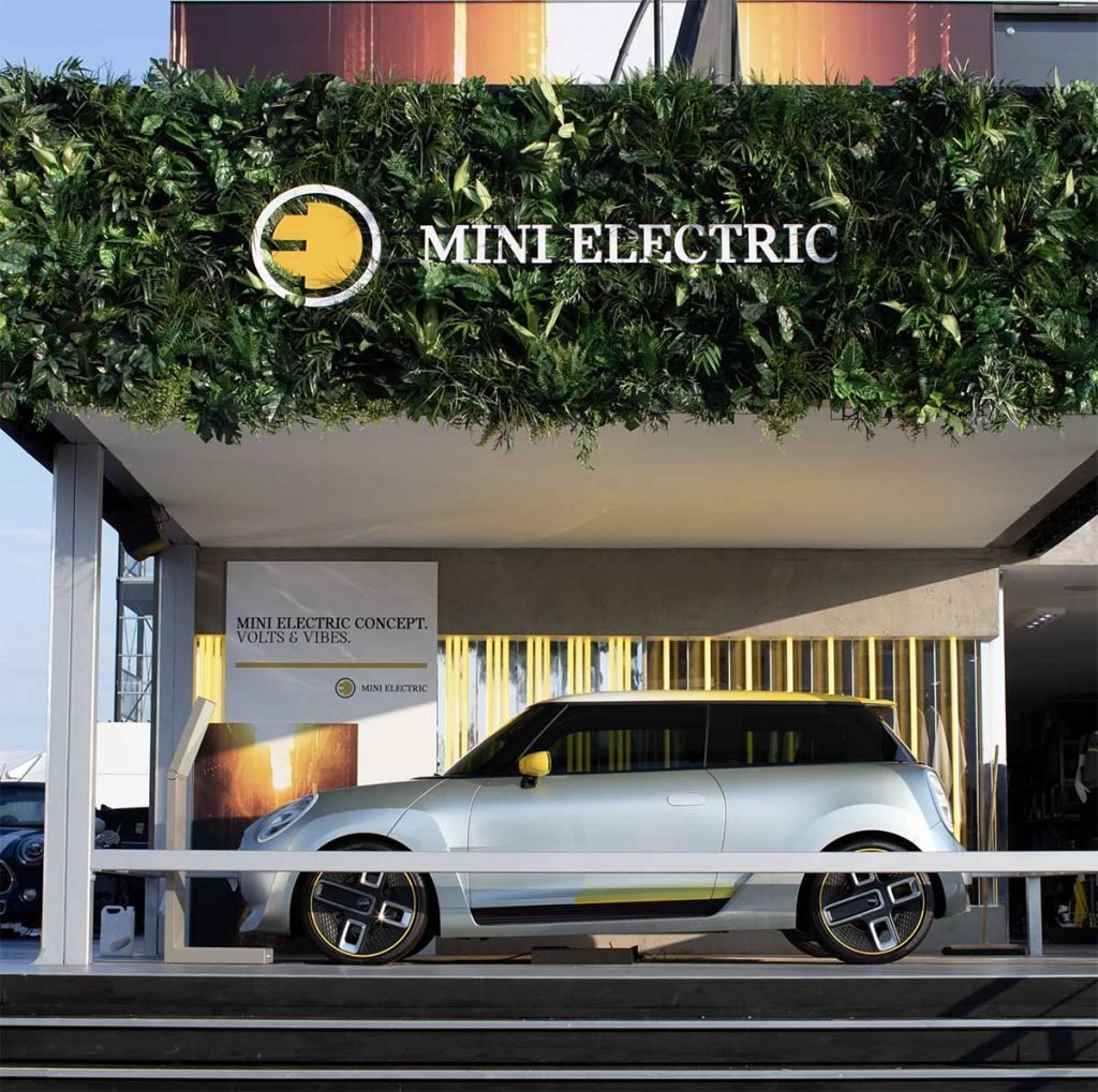 Minis’ showstopping Goodwood stand with a logo embedded artificial foliage panel bursting with green