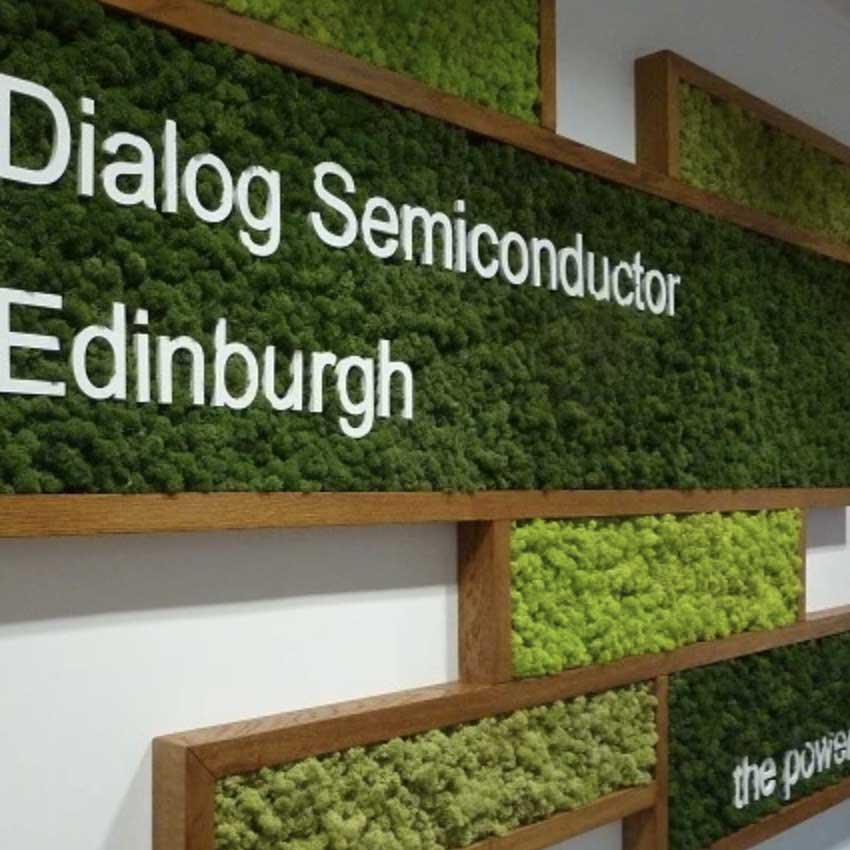 Dialog Semi-conductors bespoke panel sign of different tones of green Nordik moss encased in wooden frames