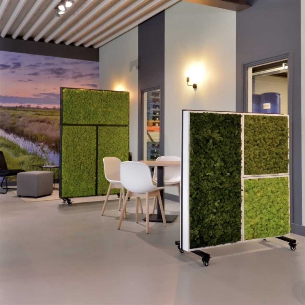 Living wall panels filled with plant life on wheels to divide and separate open plan space in a modern office space