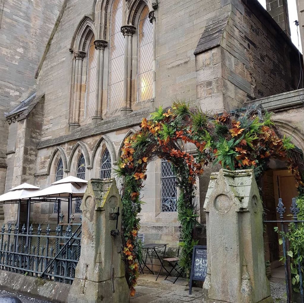 The bespoke arches of Webster’s Theatre in Glasgow entwined with artificial greenery and autumnal tones