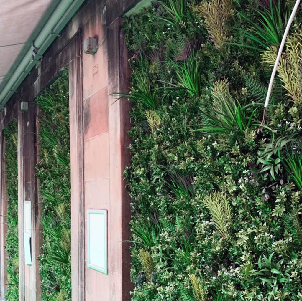 green wall panels are a great way to decorate any exterior wall that needs a little bit of cheering up