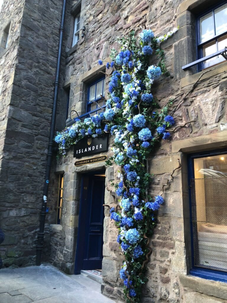 Stunning bespoke built outdoor floral display with mixture of artificial blue flowers for the islander, edinburgh