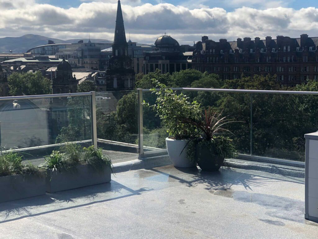 Plants on a balcony are a great way to help provide a safe barrier as well as looking aesthetically pleasing!