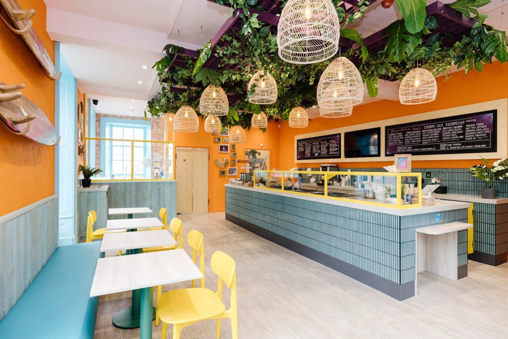 Realistic artificial foliage on this restaurants ceiling help provide a lush, tropical feel