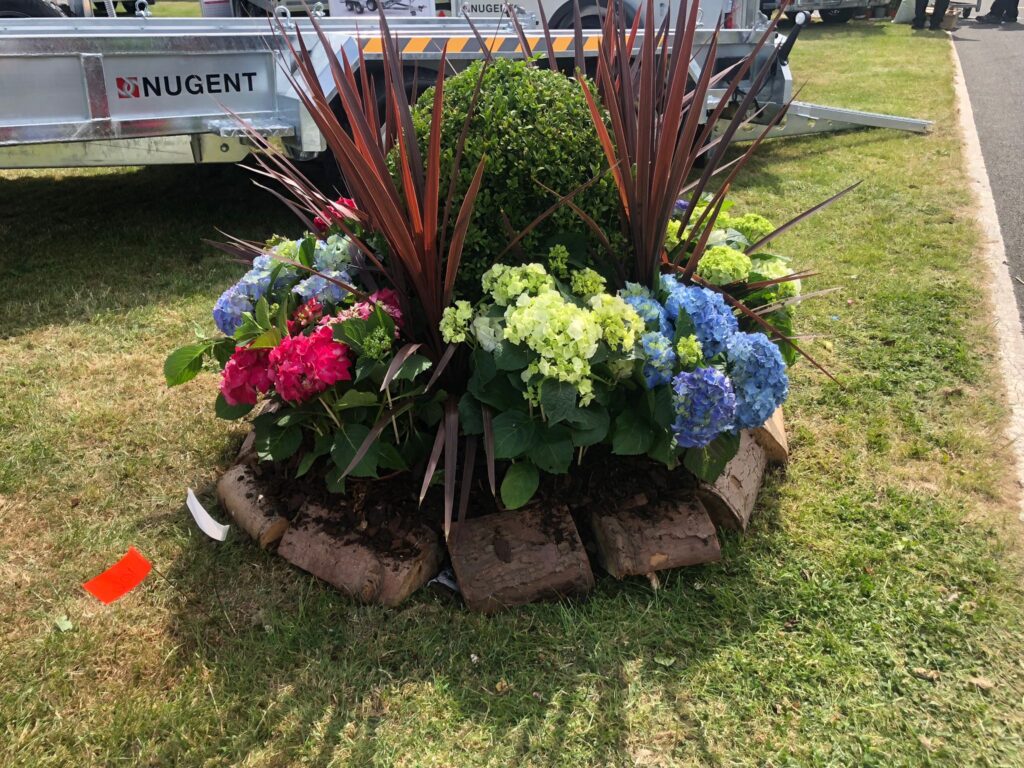 A bright exterior floral display for an event really stands out!