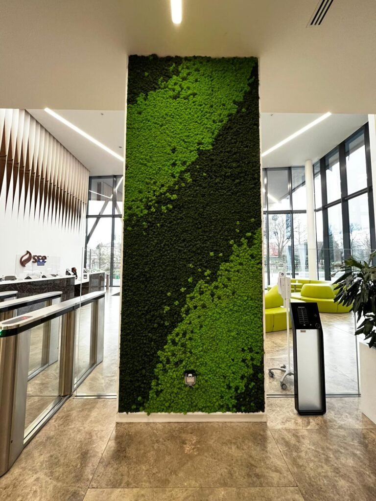 A patterned spring and dark green moss panel transforms an empty wall to create a statement