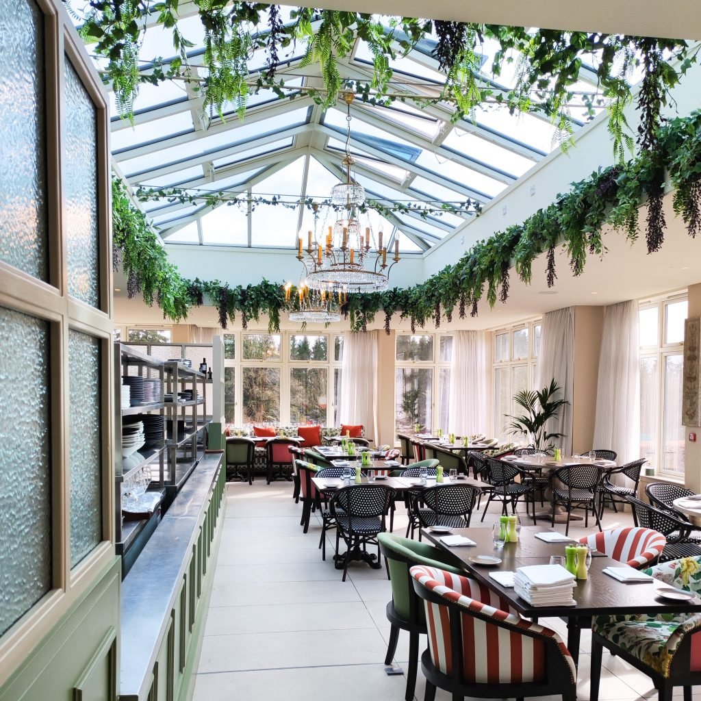 Artificial trailing foliage and ivy line the lightwell of the Cromlix