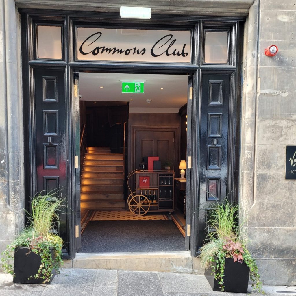 Outside the Virgin Hotel Common's Club in Edinburgh sits two square black planters with mixed live grasses