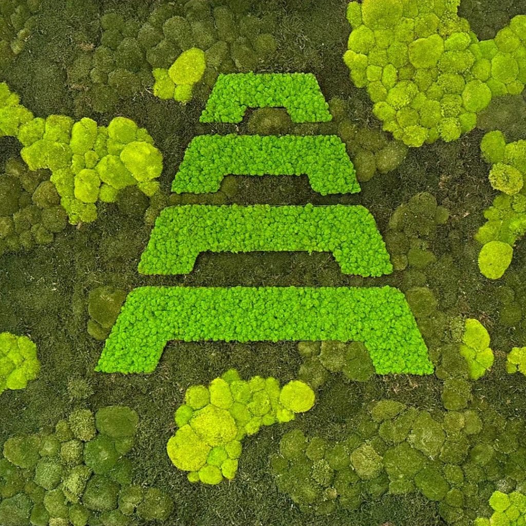 A bespoke mixed nordik moss wall with a logo for aspect aberdeen
